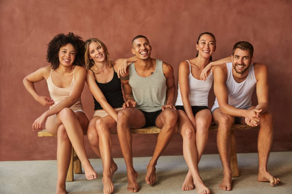 group of young people in their underwear smiling