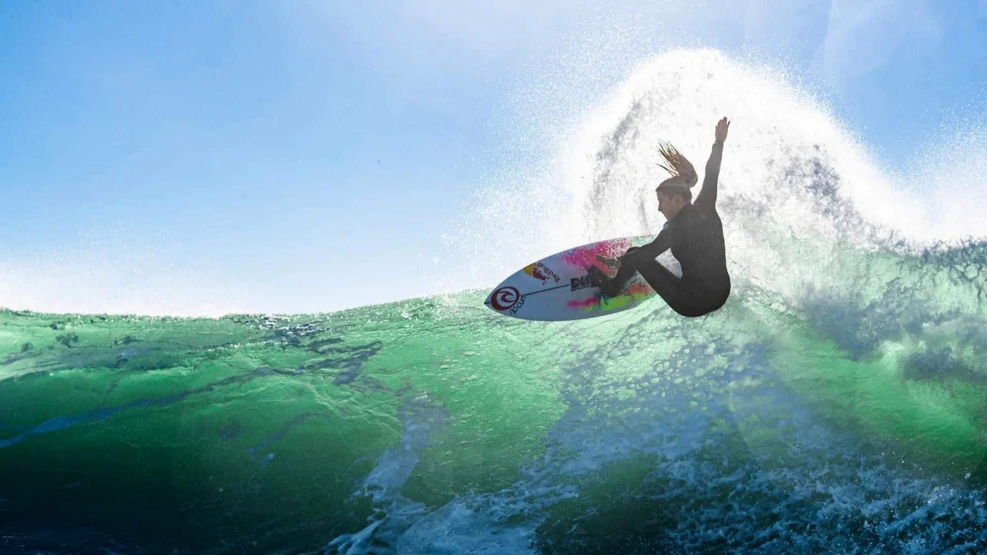 Woman surfer riding a wave