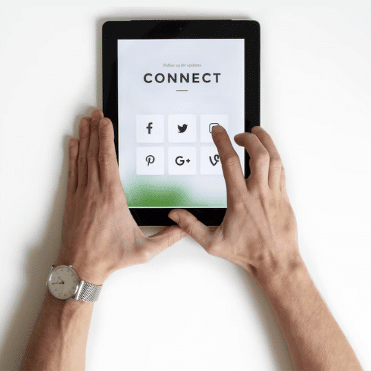 connect - social media and email channels on ipad with hands holding ipad